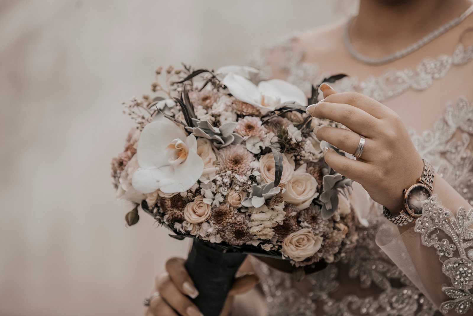 Crop bride with flower bouquet on wedding day